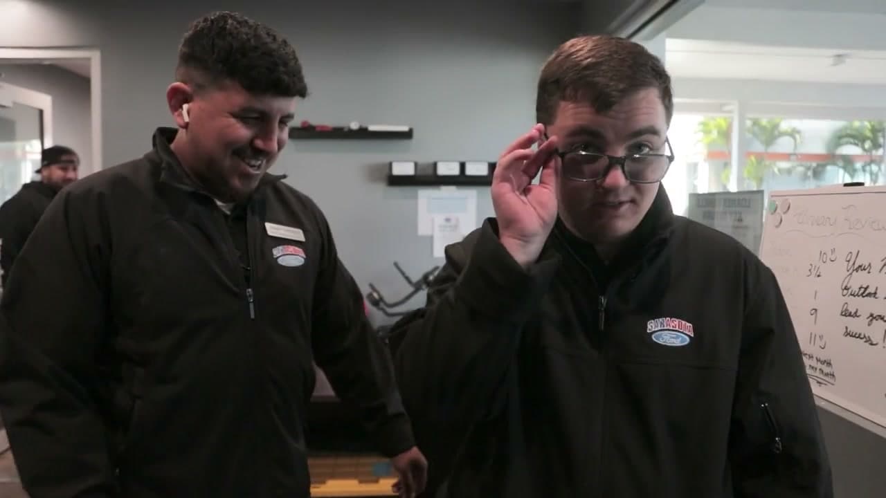 Nick and a colleague working together at Sarasota Ford